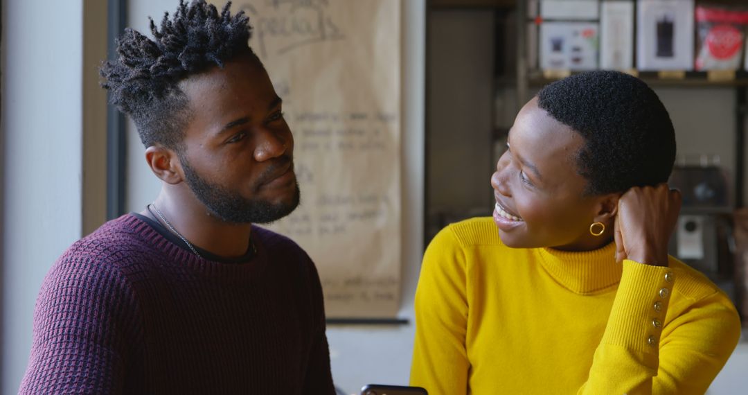 Cheerful Conversation Between Friends in Relaxed Setting