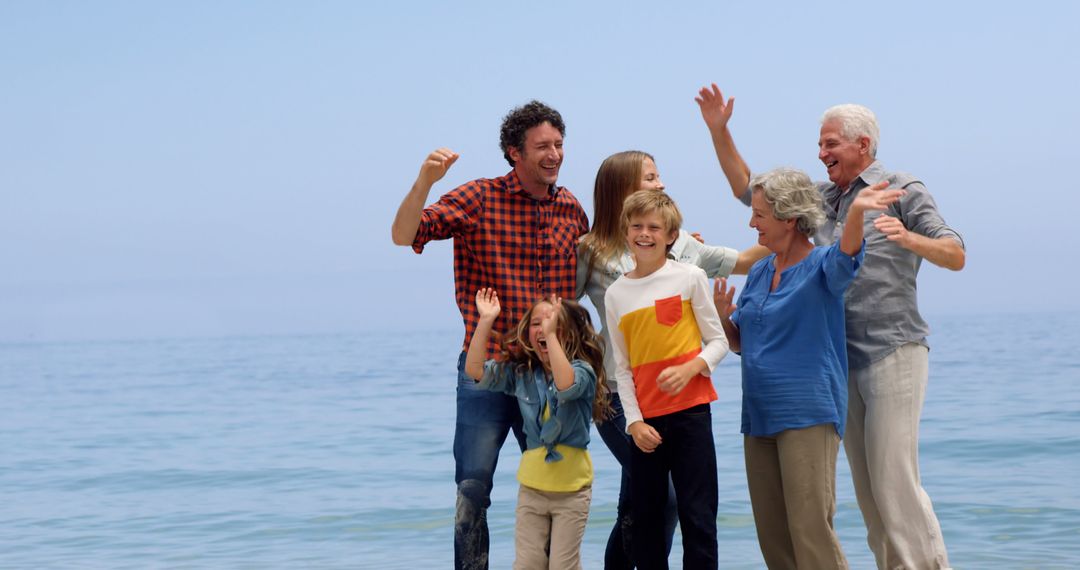 Happy Multigenerational Family Celebrating on a Beach - Free Images, Stock Photos and Pictures on Pikwizard.com