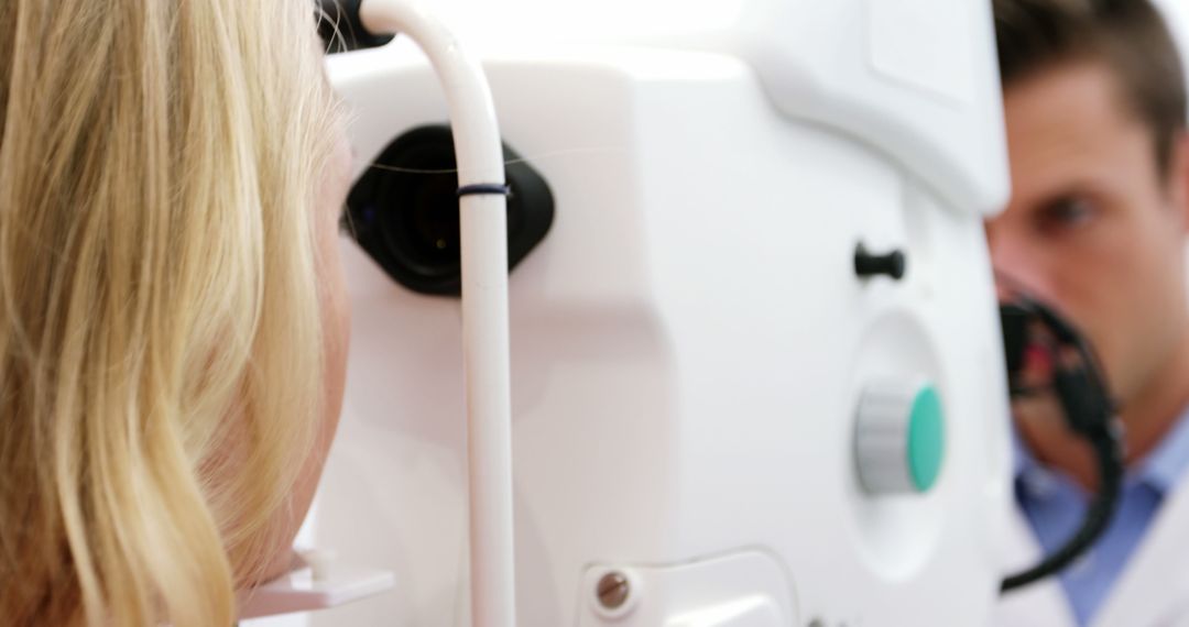 Optometrist Performing Eye Exam on Female Patient with Optometry Equipment - Free Images, Stock Photos and Pictures on Pikwizard.com