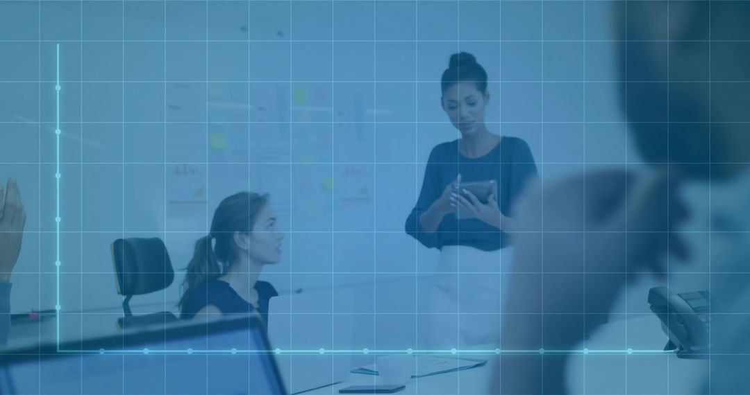 Businesswoman Presenting Data on Tablet during Team Meeting