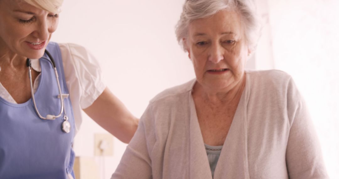 Elderly Woman Receiving Care from Female Nurse at Home - Free Images, Stock Photos and Pictures on Pikwizard.com