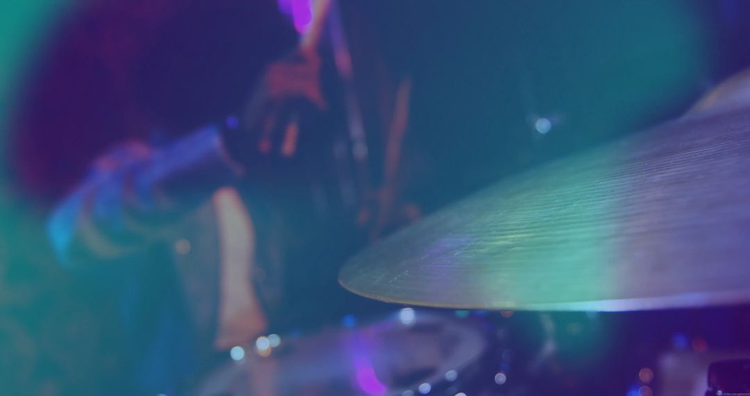 Close-Up of Drum Cymbal with Vibrant Stage Lights