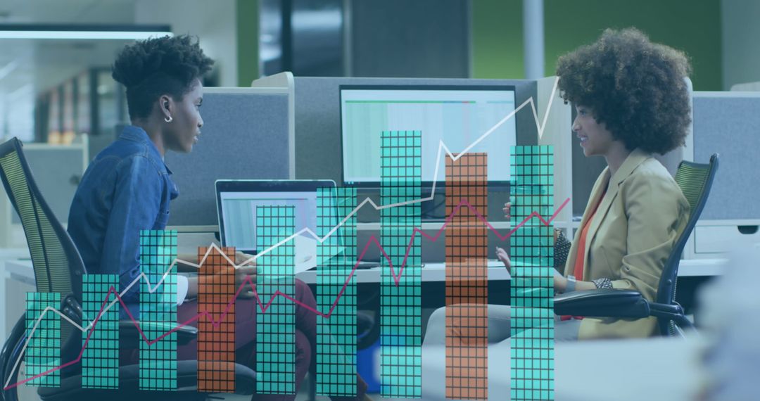 Diverse Business Team Analyzing Digital Data and Graphs in Modern Office