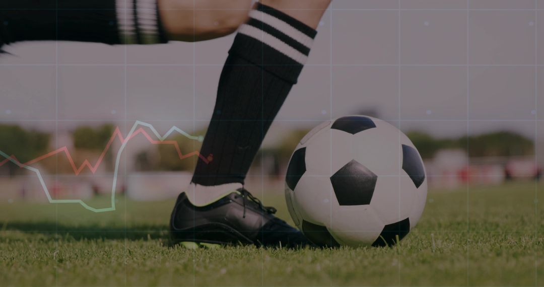 Female Soccer Player Kicking Ball on Grass Field