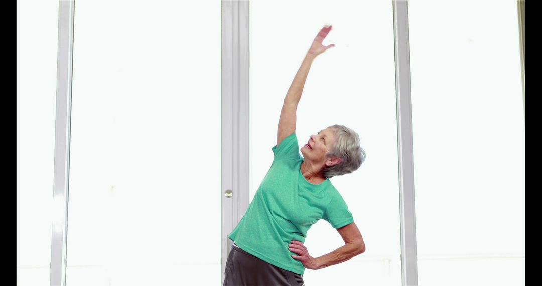 Senior Woman Exercising Indoors for Healthy Living - Free Images, Stock Photos and Pictures on Pikwizard.com