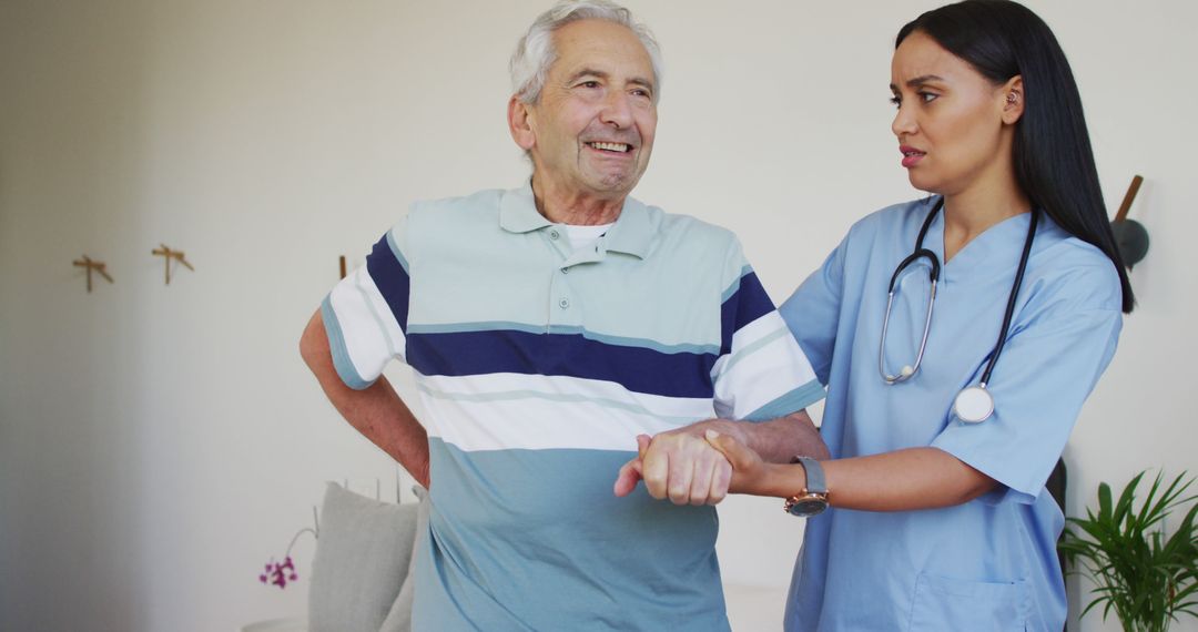 Nurse Assisting Senior Man Walking at Home - Free Images, Stock Photos and Pictures on Pikwizard.com