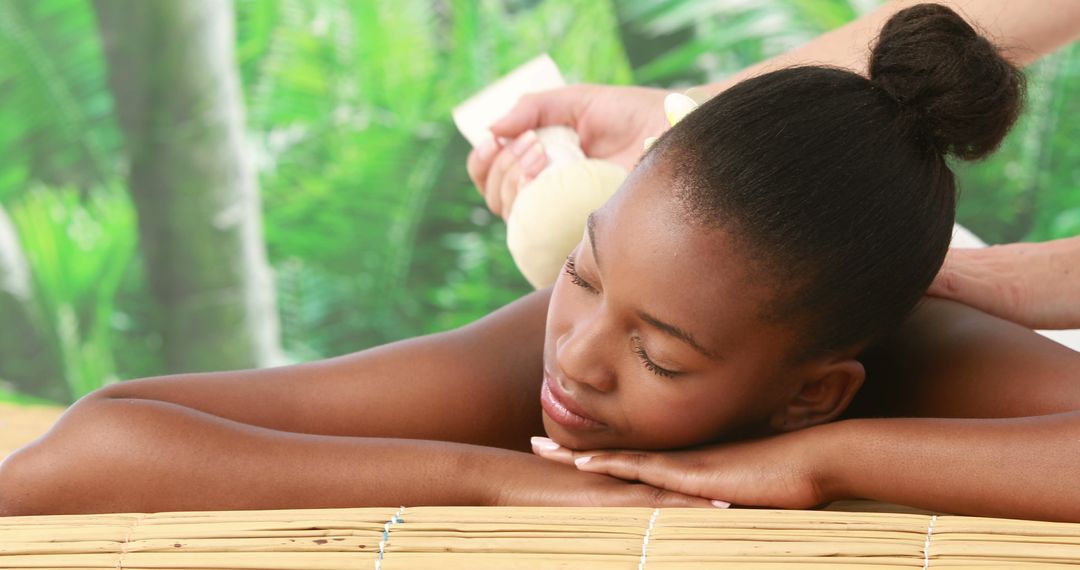 Woman Receiving Relaxing Spa Massage in Tropical Setting - Free Images, Stock Photos and Pictures on Pikwizard.com