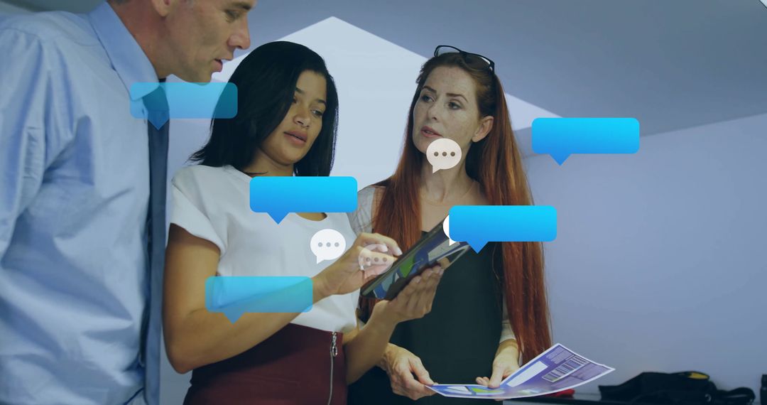 Diverse Colleagues Collaborating with Digital Interface in Office