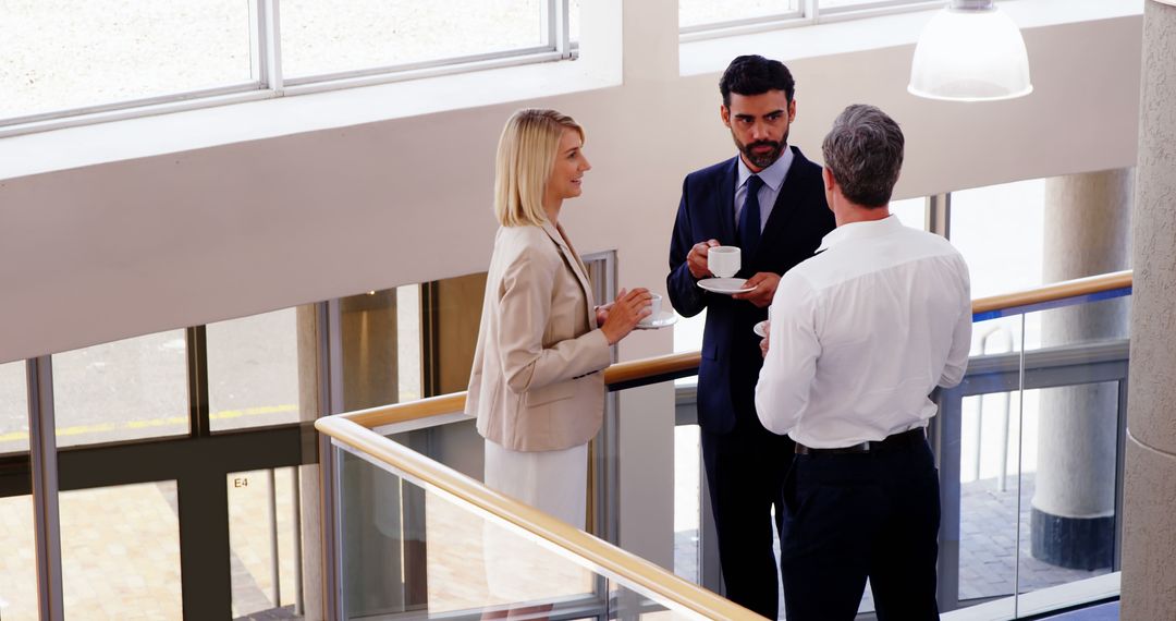 Caucasian Business Professionals Conversing on Office Balcony