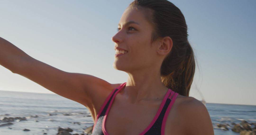 Fit Woman Smiling While Exercising Near Beach - Free Images, Stock Photos and Pictures on Pikwizard.com