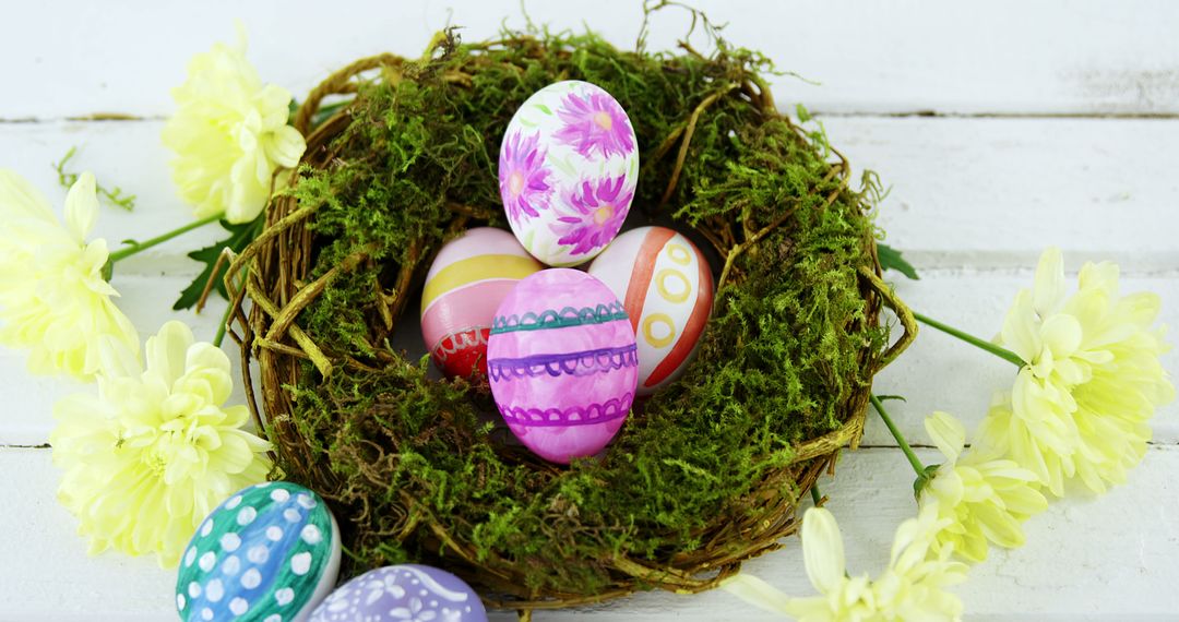 Colorful Easter Eggs in decorative Nest with Yellow Flowers - Free Images, Stock Photos and Pictures on Pikwizard.com