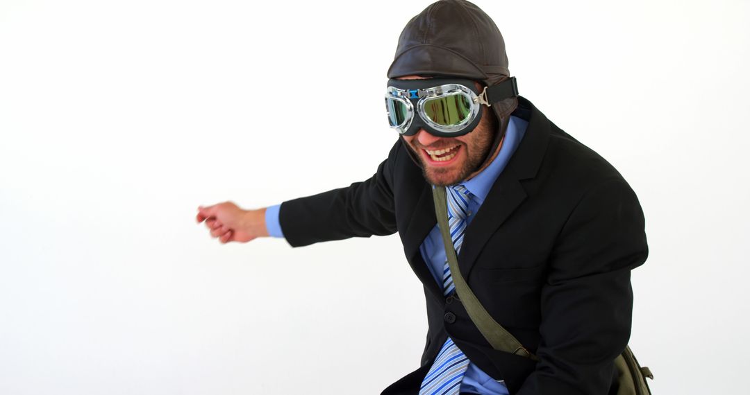 Businessman in Suit and Aviator Goggles Pretending to Fly Against White Background - Free Images, Stock Photos and Pictures on Pikwizard.com