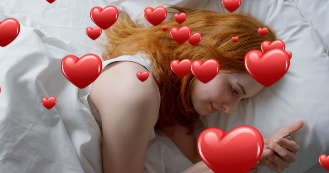 Red Haired Woman Texting in Bed with Heart Emojis
