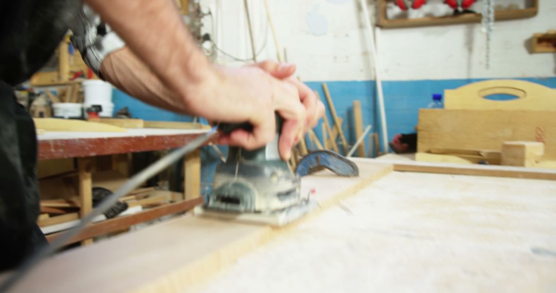 Carpenter Polishing Wooden Surface in Workshop - Free Images, Stock Photos and Pictures on Pikwizard.com