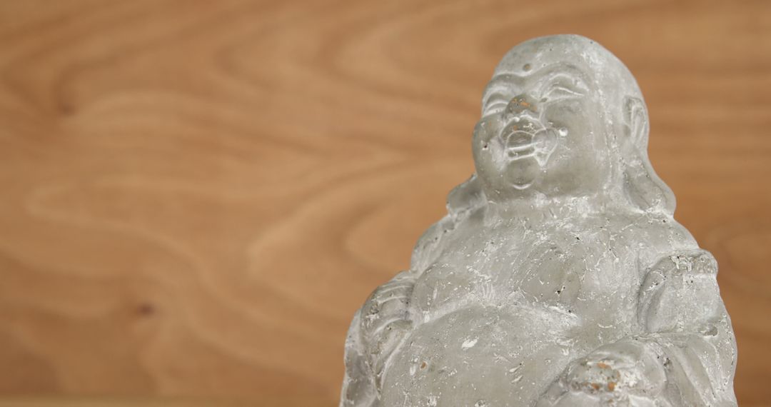 Close-up of Grey Buddha Statue on Wooden Background - Free Images, Stock Photos and Pictures on Pikwizard.com