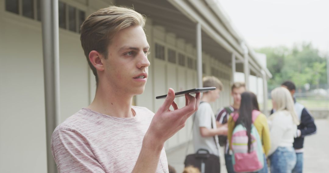 Teenager Using Smartphone for Recording and Communication