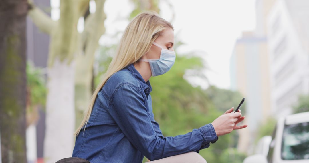 Young Woman With Face Mask Using Smartphone Outdoors - Free Images, Stock Photos and Pictures on Pikwizard.com