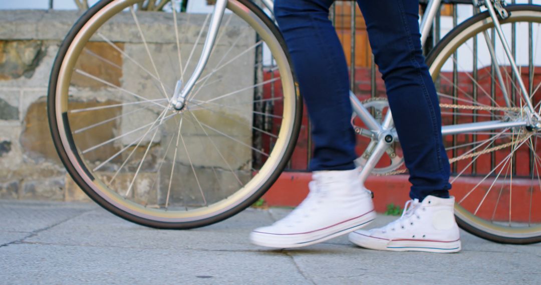 Casual Urban Walking with Bicycle and White Sneakers - Free Images, Stock Photos and Pictures on Pikwizard.com