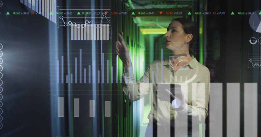 Female Engineer Analyzing Data in Server Room Environment