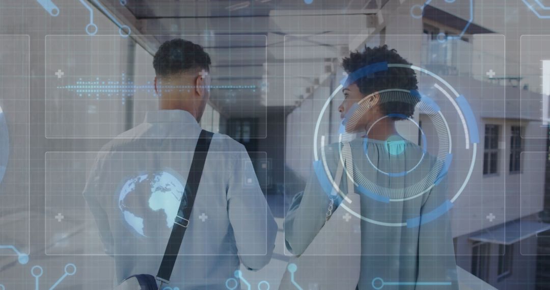 Colleagues Exploring Futuristic Corridor with Holographic Interface