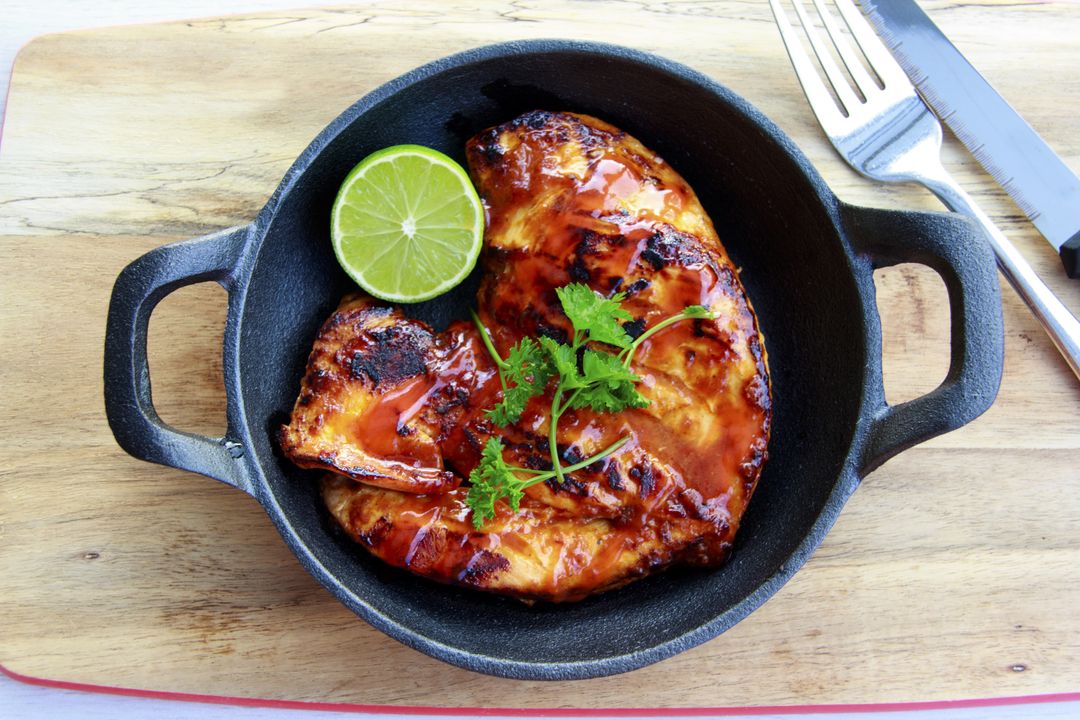 Honey-Glazed Grilled Chicken Breast in Cast Iron Skillet with Lime and Parsley