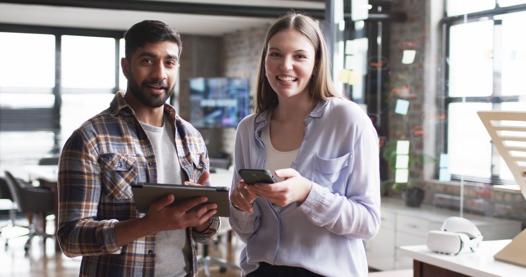 Multiracial Colleagues Smiling During Office Collaboration