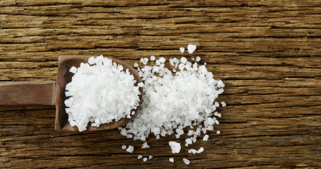 Close-Up of Coarse Sea Salt in Wooden Scoop on Rustic Wooden Surface - Free Images, Stock Photos and Pictures on Pikwizard.com