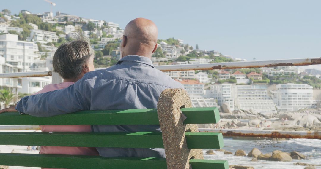 Older Couple Relaxing on Bench Overlooking Coastal Cityscape - Free Images, Stock Photos and Pictures on Pikwizard.com