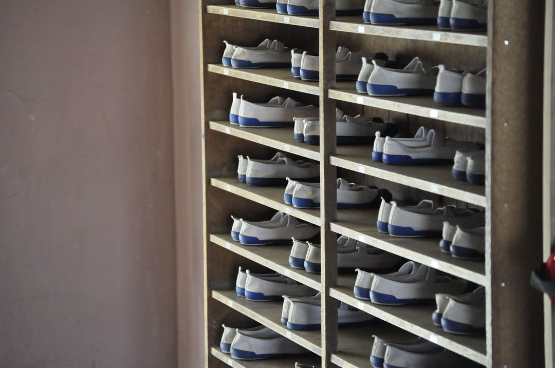 Organized Shelves of White Gym Shoes - Free Images, Stock Photos and Pictures on Pikwizard.com