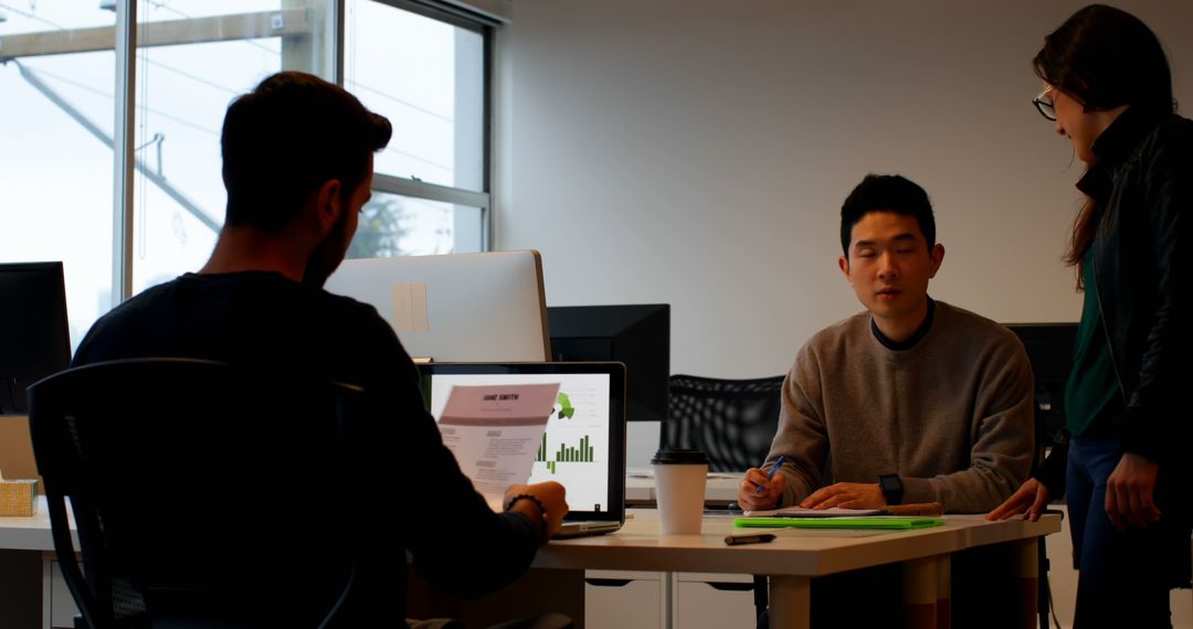 Team Meeting Collaboration in Modern Office Space