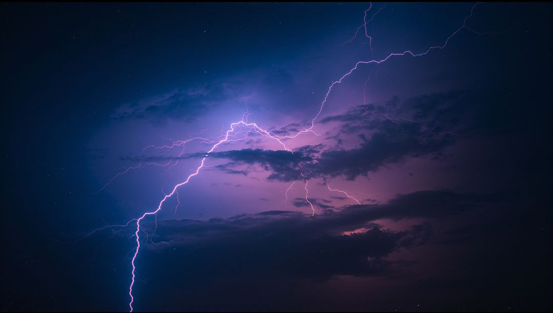 Violet Night Sky with Dramatic Lightning and Storm Clouds
