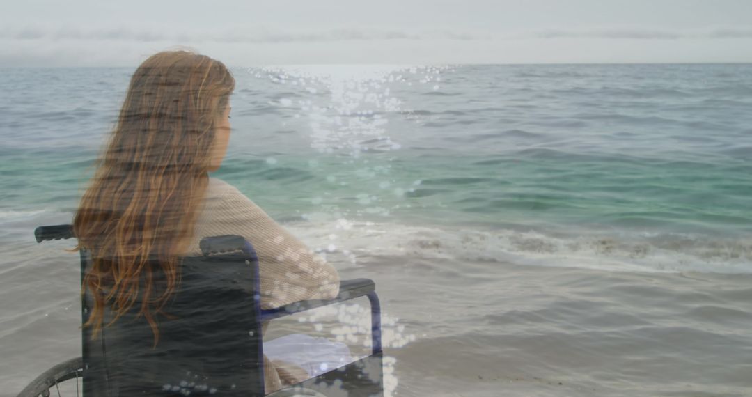 Woman in Wheelchair Overlooks Peaceful Sea in Reflective Scene