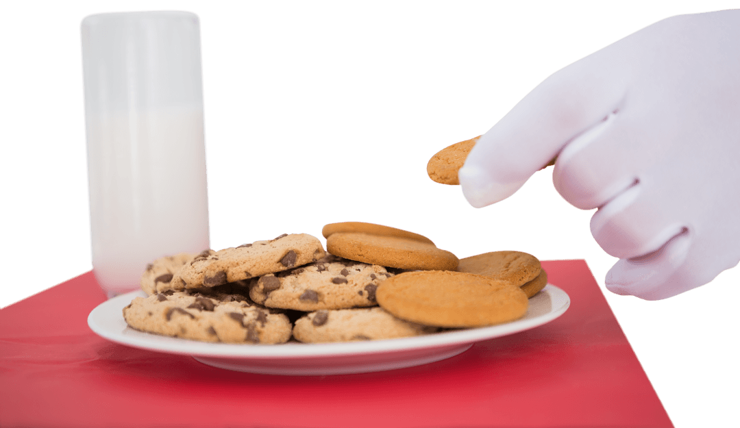 Santa's Hand Taking Cookie with Milk on Transparent Background