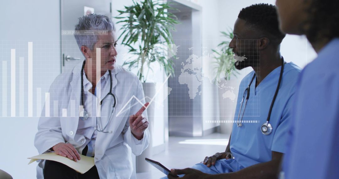 Senior physician pointing at holographic medical data while team reviewing tablet