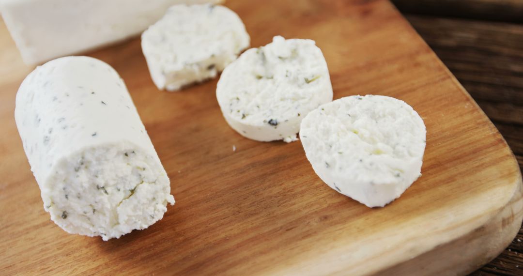 Fresh Goat Cheese Slices on Wooden Cutting Board - Free Images, Stock Photos and Pictures on Pikwizard.com