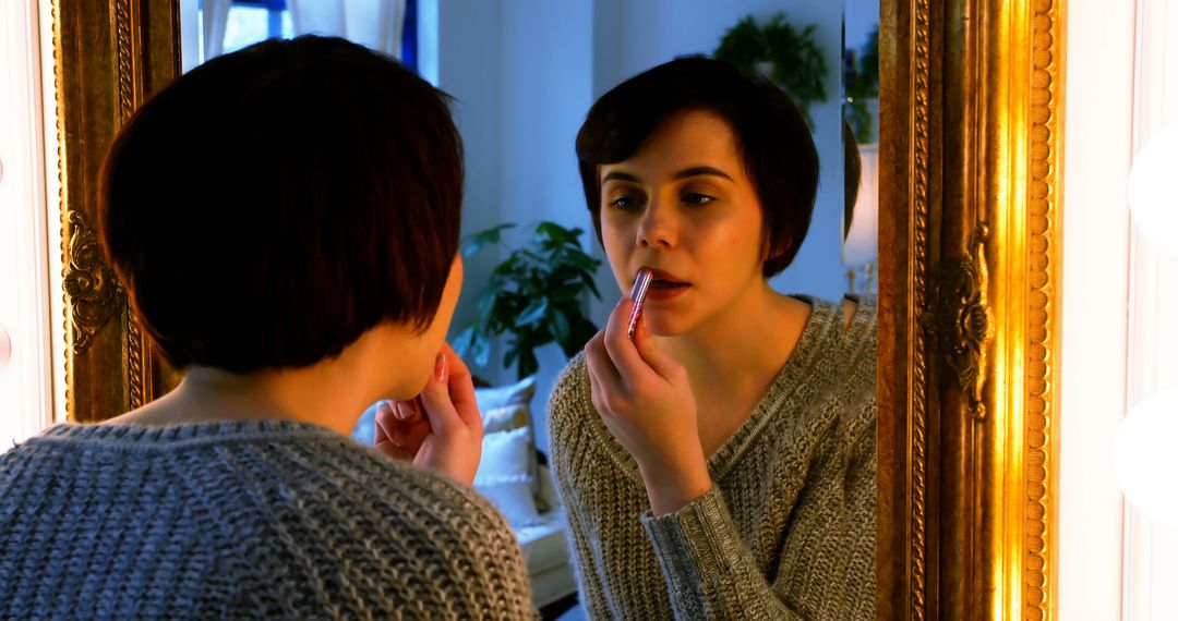 Woman Applying Lipstick in Front of Mirror Reflective Scene