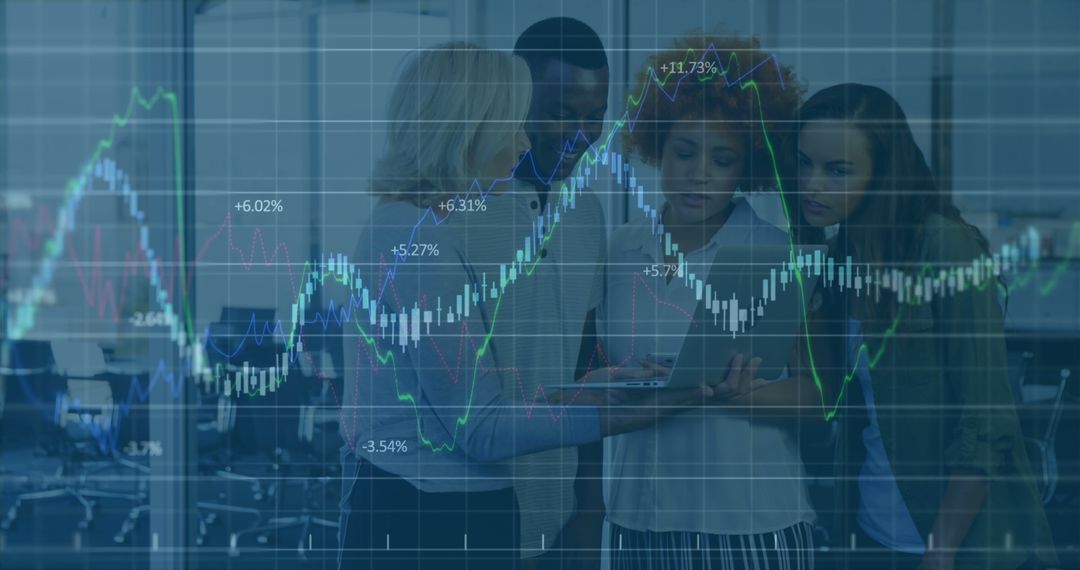 Diverse Team Analyzing Stock Market Data on Laptop in Office - Free Images, Stock Photos and Pictures on Pikwizard.com