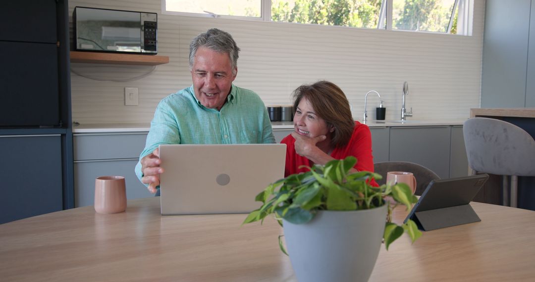 Senior Couple Using Technology for Planning at Home