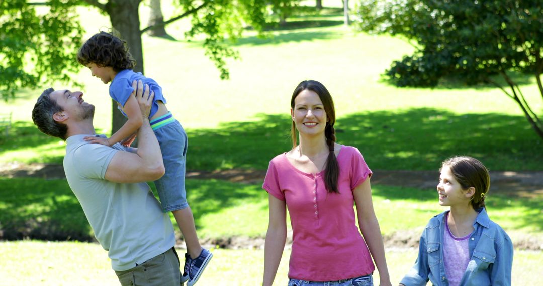 Happy family enjoying day in park - Free Images, Stock Photos and Pictures on Pikwizard.com