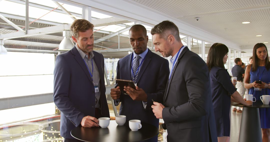 Business Professionals Networking and Collaborating During Conference Break