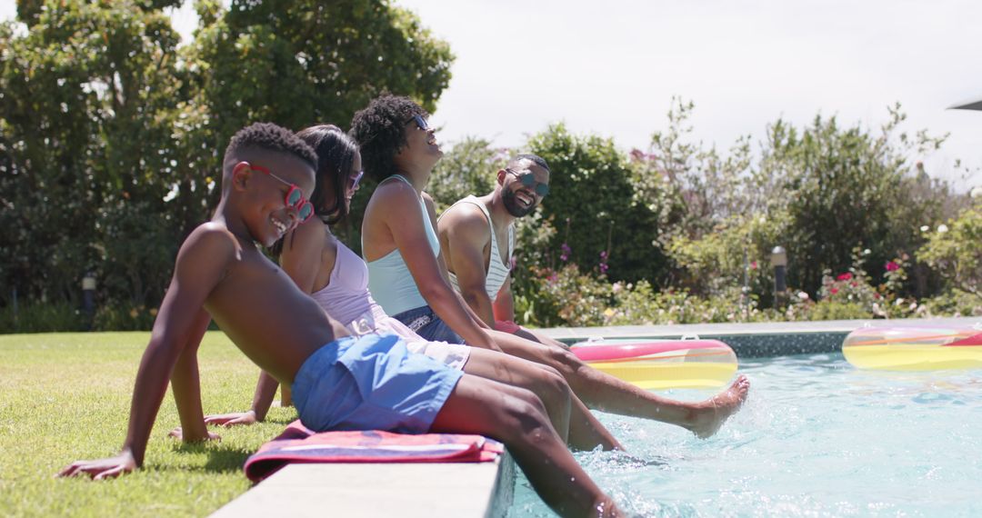 Family Smiling and Relaxing by Swimming Pool