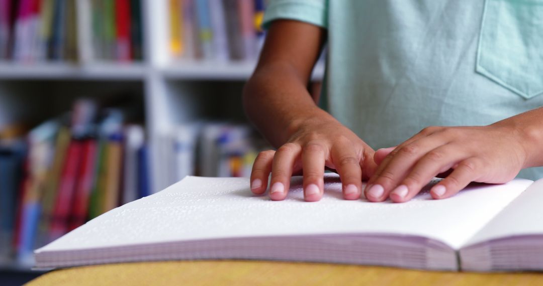 Child Reading Braille Book in Classroom Library - Free Images, Stock Photos and Pictures on Pikwizard.com