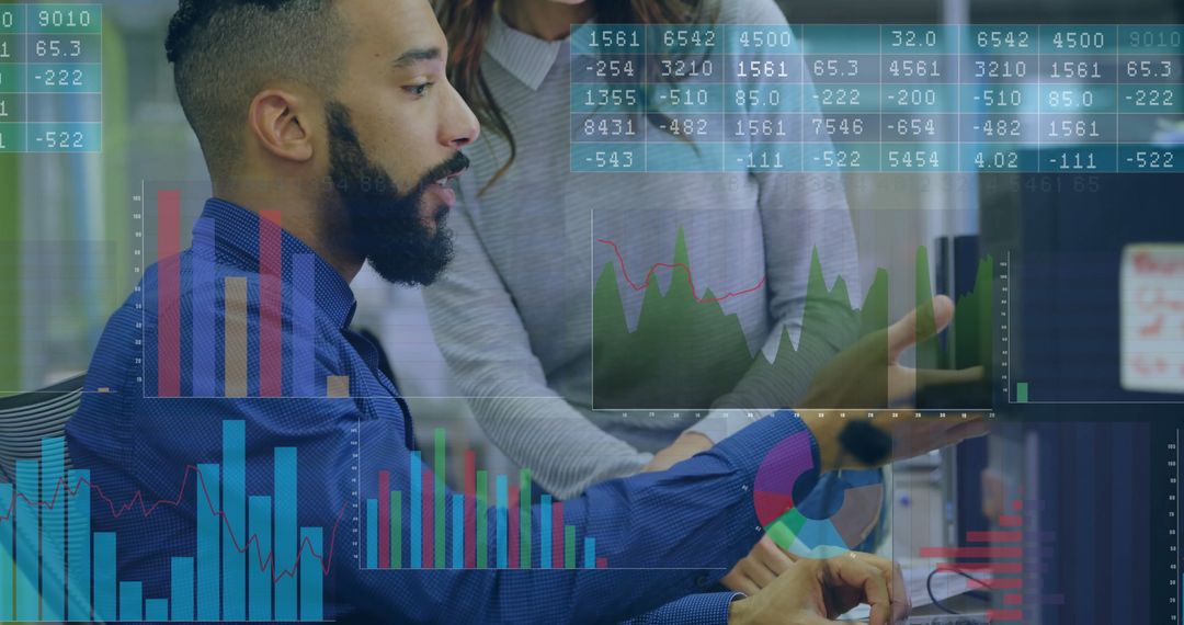 Financial Analyst Examining Charts in Modern Office Workspace