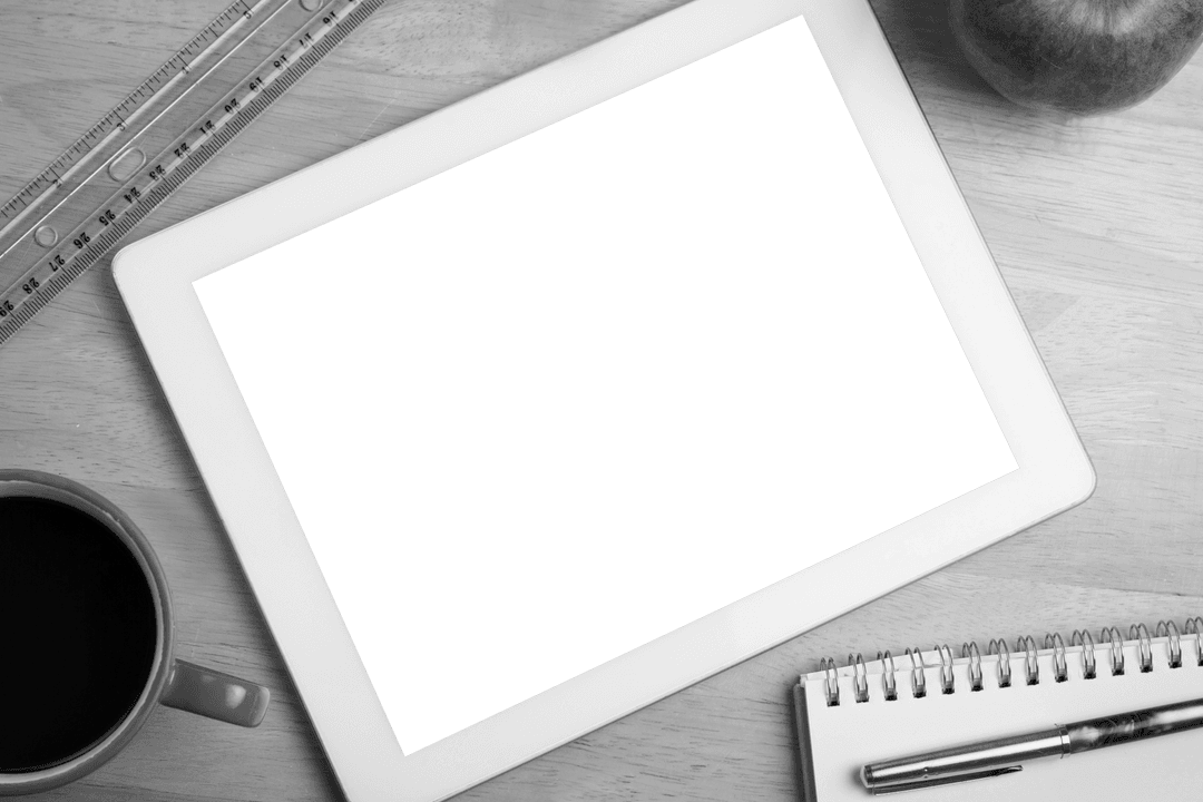 Transparent Digital Tablet with Office Supplies Background