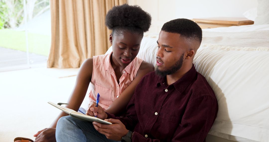 Couple Engaged in Creative Brainstorming at Home