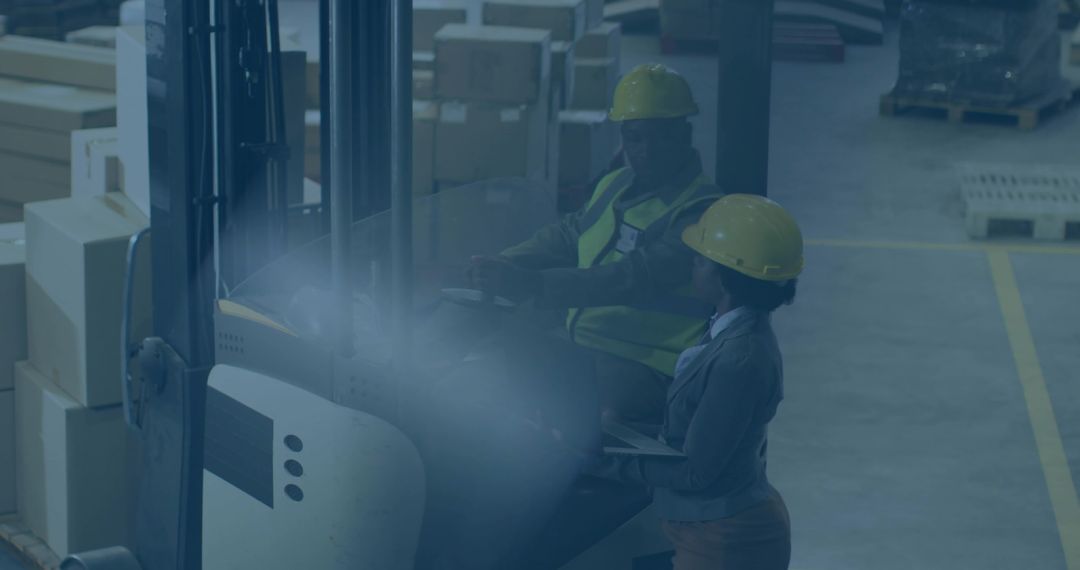 Forklift Operator and Supervisor Checking Inventory With Clipboard and Teamwork in Busy Warehouse