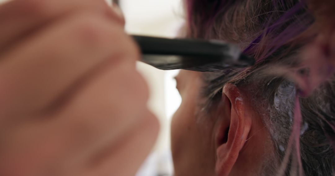 Close-up of person applying hair dye for a fresh new look - Free Images, Stock Photos and Pictures on Pikwizard.com