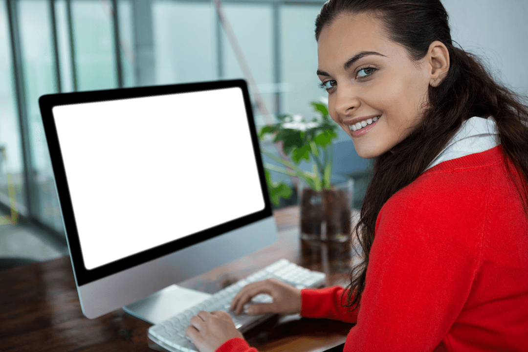 Smiling Businesswoman at Desk with Transparent Computer Screen