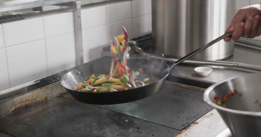 Chef Cooking Vegetables in Commercial Kitchen - Free Images, Stock Photos and Pictures on Pikwizard.com