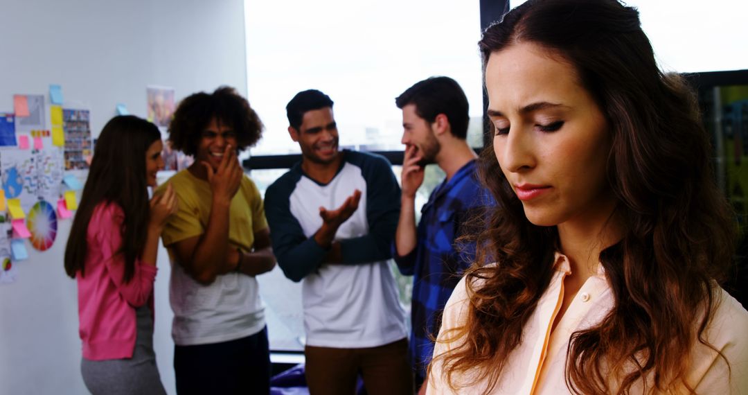 Young Woman Facing Bullying from Colleagues in Office - Free Images, Stock Photos and Pictures on Pikwizard.com